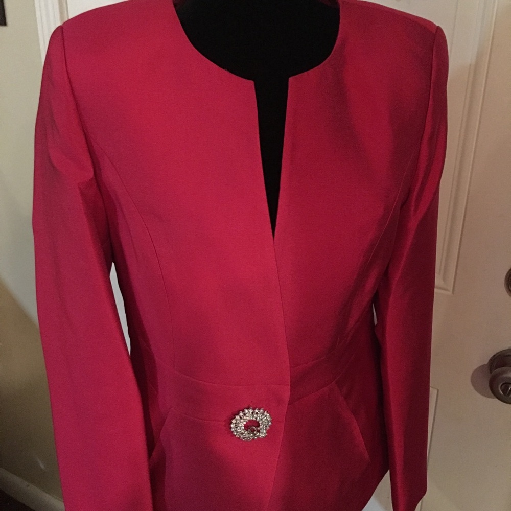 Lovely Pink suit with beautiful gold pin